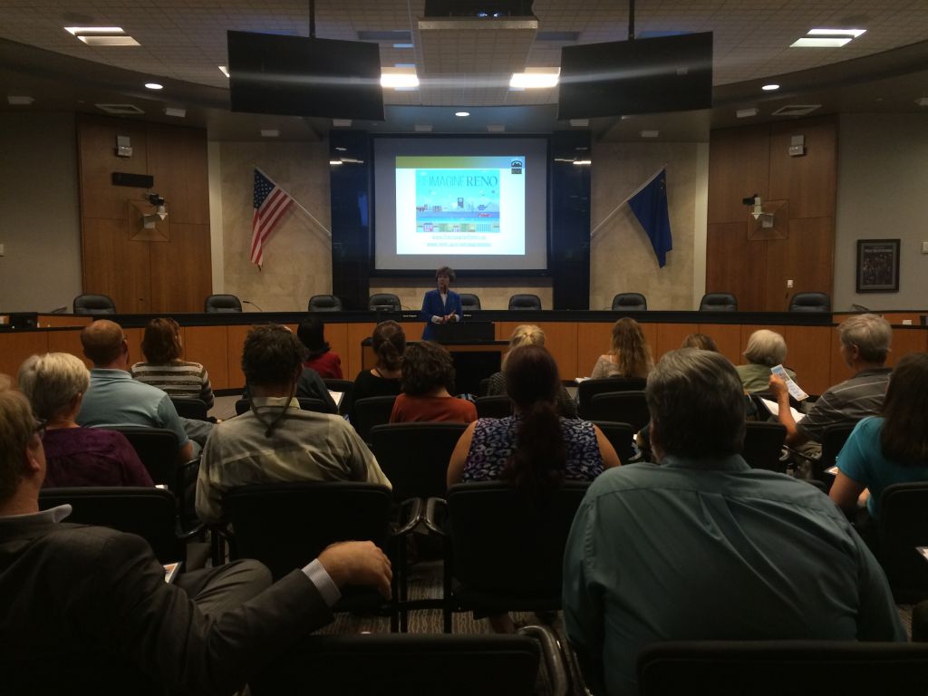 Audience watches the beginning ReImagine Reno presentation at a focus group.